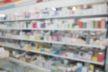 pharmacy drugstore shop interior with medicines vitamins supplement and over the counter healthcare product for healthy on shelves blur backgroundの写真素材