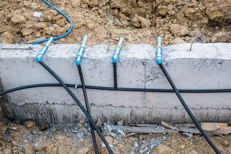 Pest control pipe system install at new house construction foundation for termite protectionの写真素材