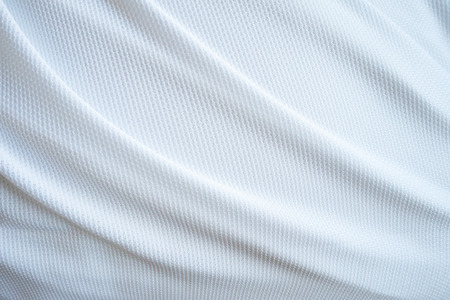 White football jersey clothing fabric texture sports wear background, close upの写真素材