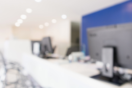 Abstract blur office desk workplace or hospital with computer defocused backgroundの写真素材