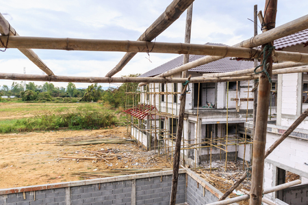 construction residential new house in progress at building siteの写真素材