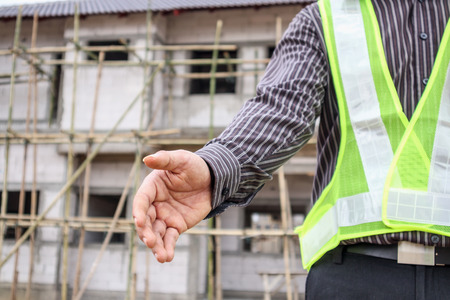 Asian business man construction engineer worker at house building siteの写真素材