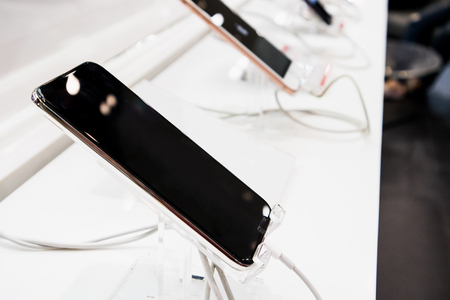 New mobile smartphone show in electronic store, digital gadget for internet and telecommunicationの写真素材