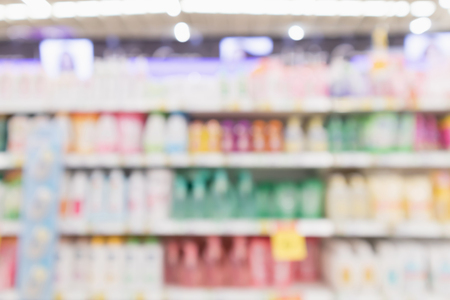 Abstract blur supermarket discount store with body care product shelves interior defocused backgroundの写真素材