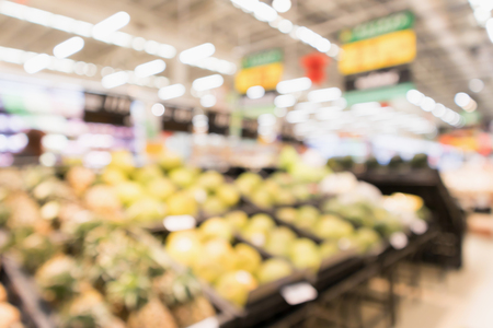 Abstract supermarket grocery store blurred defocused background with bokeh lightの写真素材