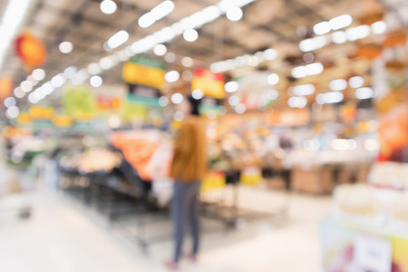 Abstract supermarket grocery store blurred defocused background with bokeh lightの写真素材