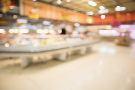 Abstract supermarket grocery store blurred defocused background with bokeh lightの写真素材