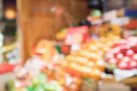 abstract blur organic fresh fruits and vegetable on grocery shelves in supermarket store defocused bokeh light backgroundの写真素材