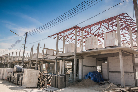 construction residential new house in progress at building siteの写真素材