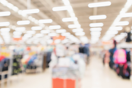 Abstract blur supermarket discount store product shelves interior defocused backgroundの写真素材