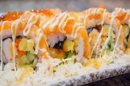 Salmon sushi sashimi and sushi rolls set close upの写真素材