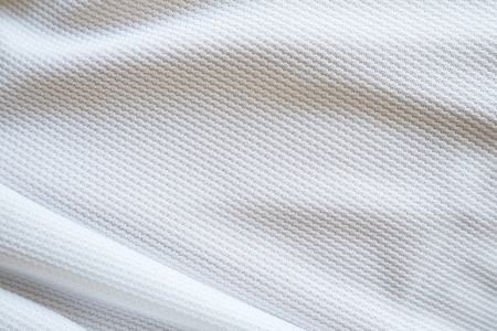 White football jersey clothing fabric texture sports wear background, close upの写真素材
