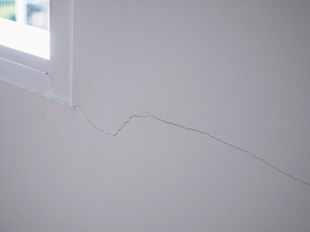 cracked on wall background close upの写真素材