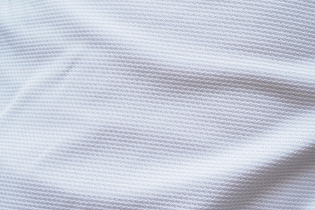 White football jersey clothing fabric texture sports wear background, close upの写真素材