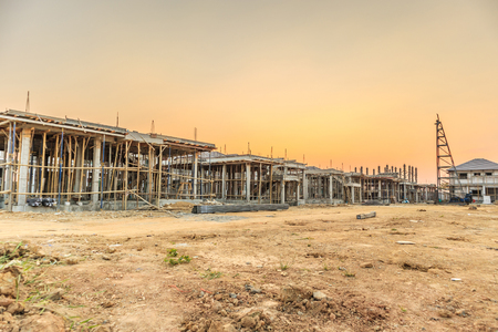installation of cement formwork frames to new house construction at building site, real estate developmentの写真素材