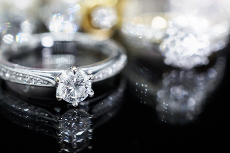 Luxury Jewelry diamond rings with reflection on black backgroundの写真素材