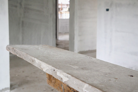 empty wood table at house building construction siteの写真素材