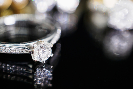 Luxury Jewelry diamond rings with reflection on black backgroundの写真素材