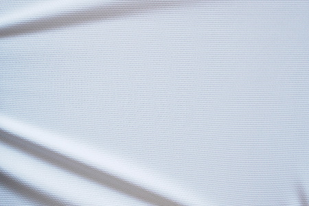 White football jersey clothing fabric texture sports wear background, close upの写真素材