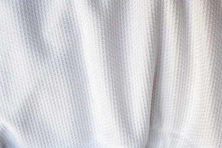 White football jersey clothing fabric texture sports wear background, close upの写真素材