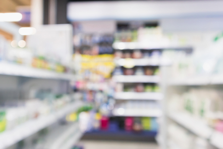 pharmacy drugstore shop interior with medicines vitamins supplement and over the counter healthcare product for healthy on shelves blur backgroundの写真素材