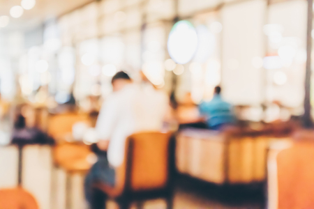 Restaurant cafe or coffee shop interior with people abstract defocused blur backgroundの写真素材