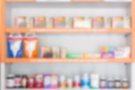 Pharmacy drugstore blur abstract backbround with medicine and food supplement healthcare product on shelvesの写真素材