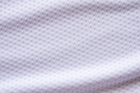 White fabric sport clothing football jersey with air mesh texture backgroundの写真素材