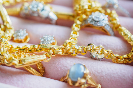 Gold and silver diamond gemstone ring necklaces and earrings in luxury jewelry box
