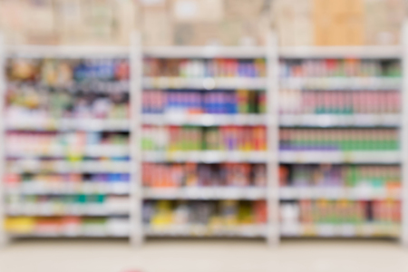 Abstract blur supermarket discount store pesticide product shelves interior defocused backgroundの写真素材