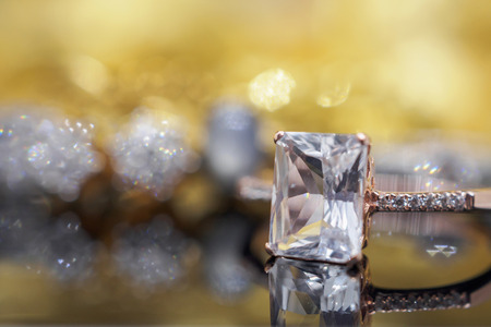 Luxury Jewelry diamond and pink topaz ring with reflection on black backgroundの写真素材