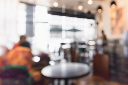 Restaurant cafe or coffee shop interior with people abstract defocused blur backgroundの写真素材