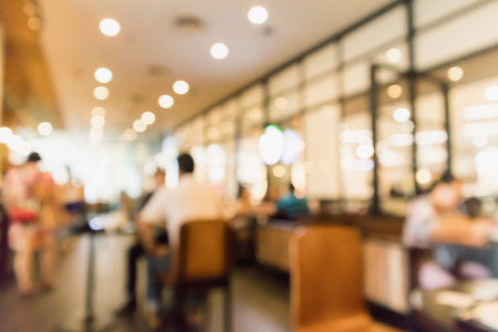 Restaurant cafe or coffee shop interior with people abstract defocused blur backgroundの写真素材