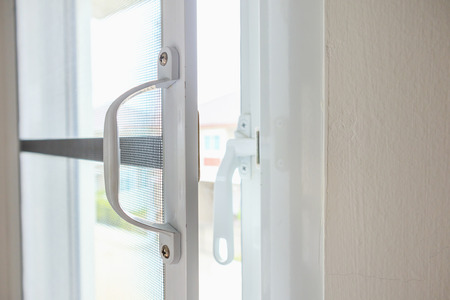 mosquito net wire screen on house window protection against insectの写真素材