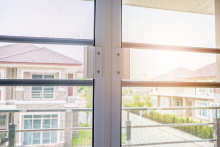 mosquito net wire screen on house window protection against insectの写真素材