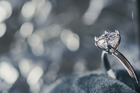 luxury engagement Diamond ring in jewelry gift box with bokeh light background