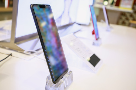 New mobile smartphone in telecommunication electronic store display showcase