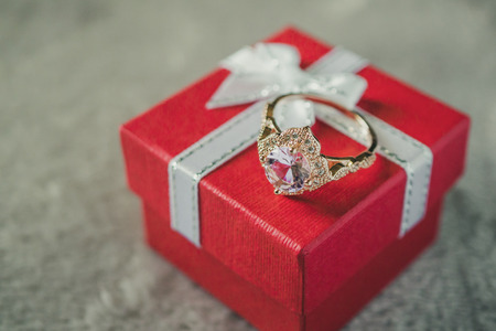 jewelry pink diamond ring on red gift box