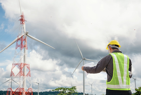 Engineer worker at wind turbine power station construction siteの写真素材