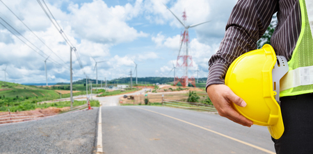 Engineer worker at wind turbine power station construction siteの写真素材