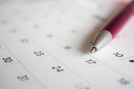 Calendar page with pen point at 17th dateの写真素材