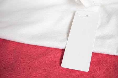 Blank price tag label on white t-shirtの写真素材