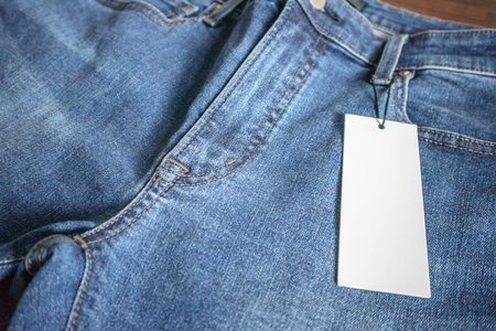 Blue jeans with blank white price label tagの写真素材