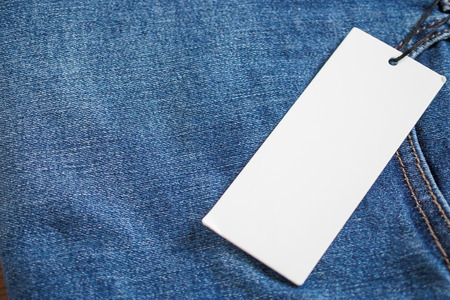 Blue jeans with blank white price label tagの写真素材