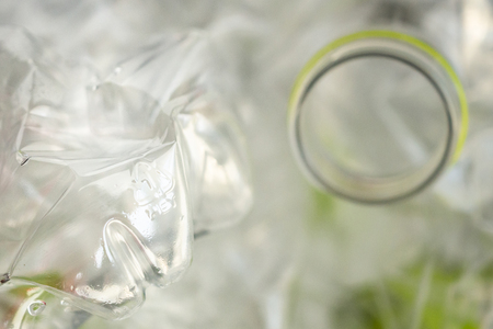 Crushed plastic bottles for recycling abstract backgroundの写真素材