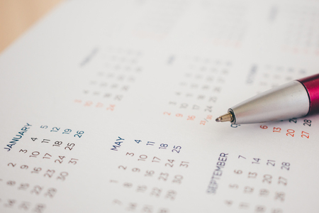 calendar page with pen close upの写真素材