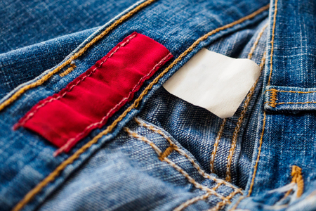 Blue denim jeans with clothing labelの写真素材