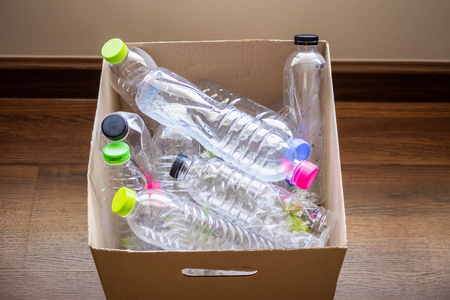 plastic bottles in recycling paper box reuse conceptの写真素材