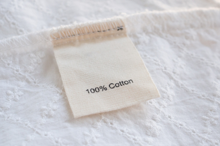 clothes label on cotton fabric texture backgroundの写真素材