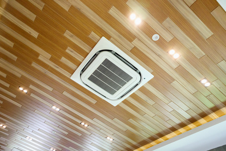 Ceiling air conditioner unit in modern roomの写真素材